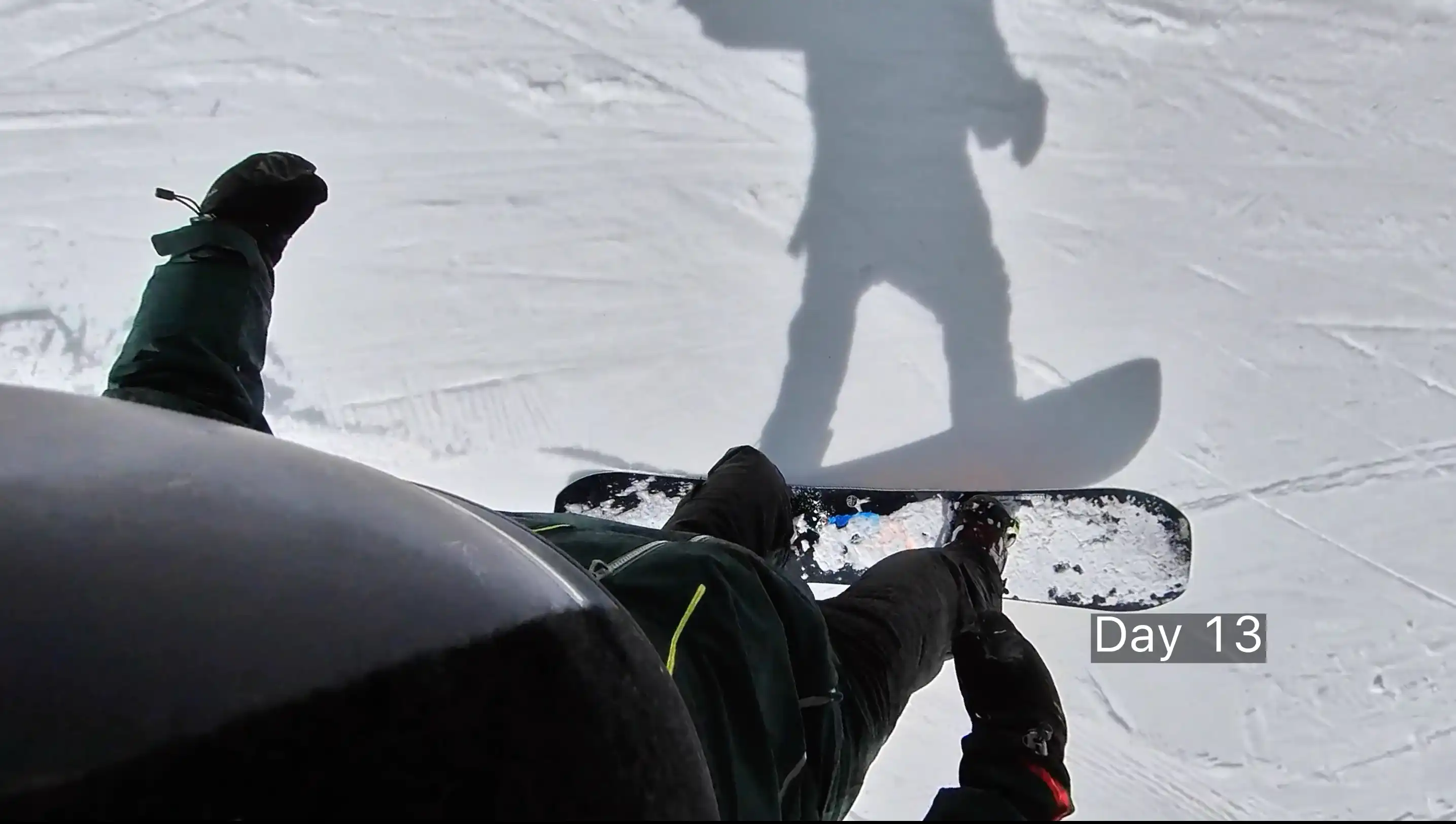 Snowboarding POV with shadow